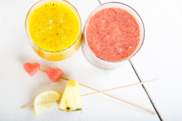 Fresh organic red and yellow smoothie with apple, watermelon, po