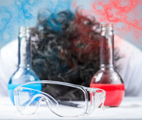 Scientist unconscious, focus on glasses