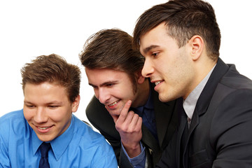 Portrait closeup of three young business people discussing