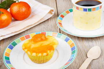 Fresh baked mini clementine cheesecakes in muffin forms