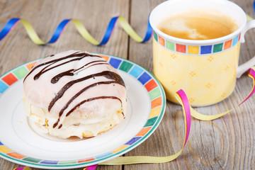 Chocolate and coconut donuts with carnival decoration.