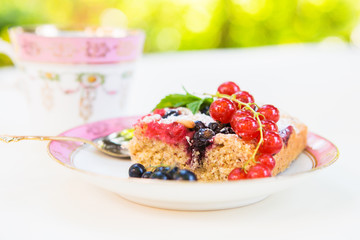 Fresh baked red and black currant berries cake