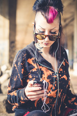 young beautiful punk dark girl using tablet