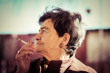 old lady smoking a cigar