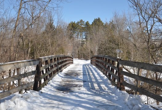 Snow covered wooden bridge