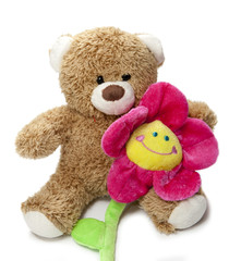 ours en peluche et fleur rose