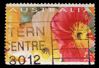 Stamp printed in Australia shows red and yellow flowers