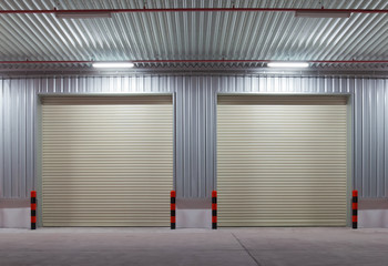 Roller door or roller shutter. Also called security door. Automatic operation with electric motor. For protection home or building i.e. factory, warehouse, hangar, workshop, shop, store and garage.