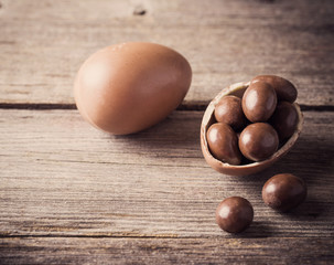Chocolate Easter Eggs Over Wooden Background