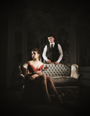 Obraz premium Young couple portrait with rose flower