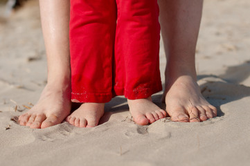 Fototapeta na wymiar Feet and toes in the sand