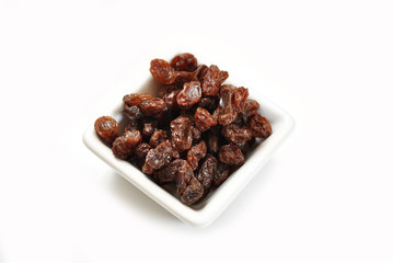 A Healthy Treat of Dried Raisins in a Square Bowl