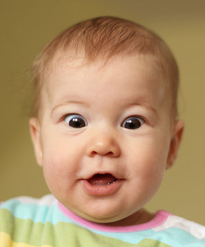 Portrait of astonished young baby