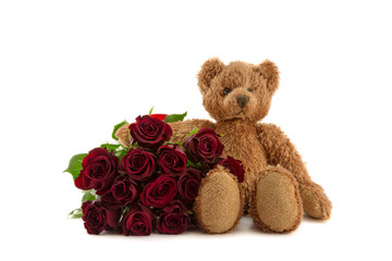 Twelve red roses and teddy.