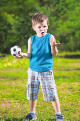 cute boy with football ball