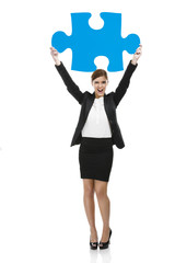 Businesswoman with a puzzle piece