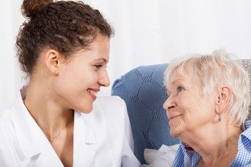 Nurse spending time with elderly lady