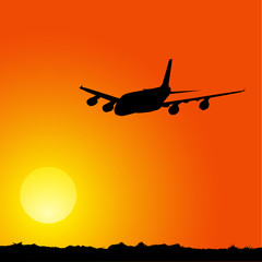 plane on a sunset background