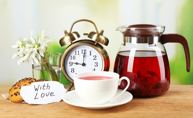 Tasty herbal tea and cookies on wooden table