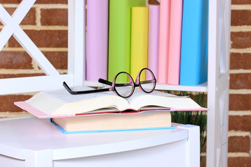 Composition with glasses and books,