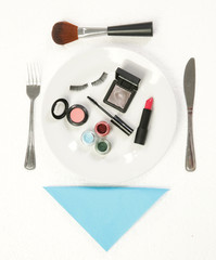 Makeup accessories on the dinner plate