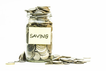 Isolated coins in jar with saving label