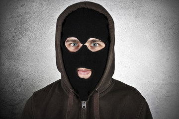 Criminal wearing military mask