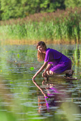 Young woman ralax near lake