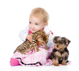 little girl with puppy hugging a kitten. isolated on white 