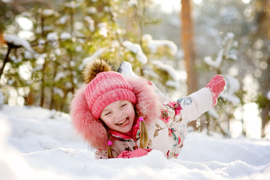 funny girl having fun in the snow