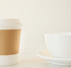A papercup versus a ceramic cup