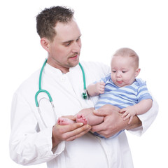 Doctor with child on his arm