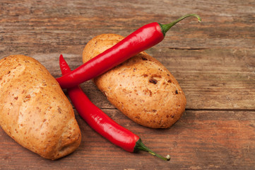 Two loaves of bread and two chilli peppers