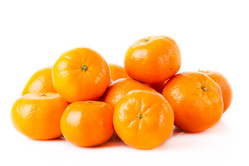 Fototapeta na wymiar ripe juicy tangerine on a white background. Clementine Mandarin