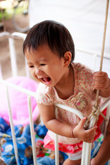 Baby standing in crib