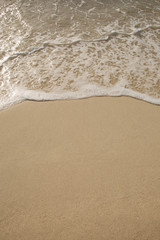 Fototapeta na wymiar Strand, Sand, Welle, Reise und Meer Hintergrund