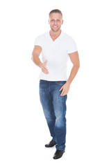 Young man holding out his hand in greeting