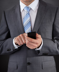 Businessman Holding Mobile Phone