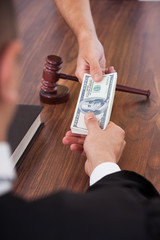 Judge Receiving Dollars From Person