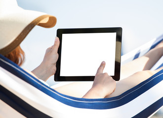 Woman Using Digital Tablet In Hammock