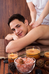 Obraz na płótnie Canvas Man Receiving Shoulder Massage In Spa