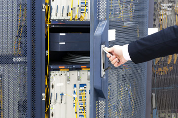 worker checking in the Telecommunication room © hxdyl