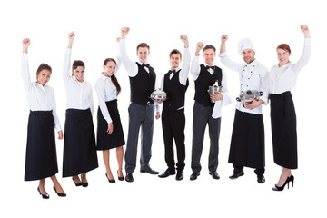 Large group of waiters and waitresses cheering