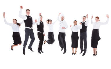 Waiters and waitresses jumping