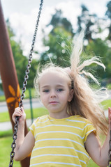 Swinging little girl