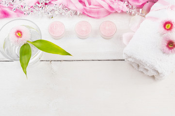 water with flower, pink candles and towel,spa border