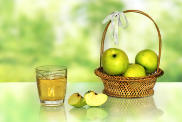 Green Apple and a glass of juice.