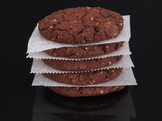 Chocolate cookies on the dark background