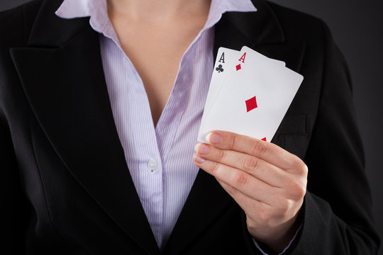 Businessperson Holding Poker Card