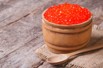 red salmon caviar in a wooden keg